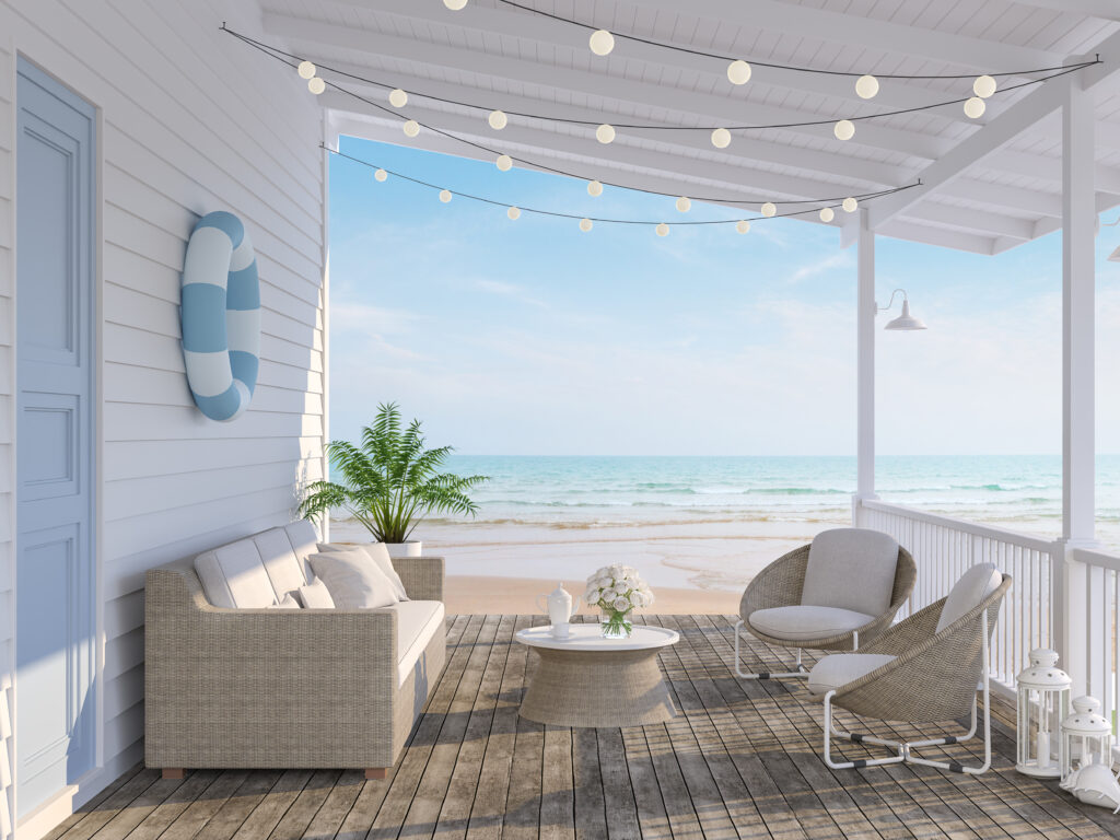 Sunlit coastal patio overlooking the ocean, relaxed outdoor living and endless summer lifestyle